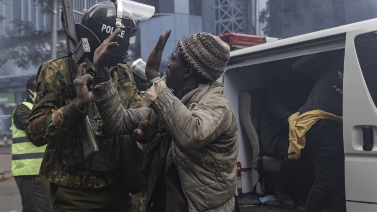 NAIROBI, KENYA - JUNE 25: A protester is detained at the Gen Z protest on June 25, 2025 in Nairobi, Kenya. Today's demonstration marks the first anniversary of the 2024 anti-government protests against the Finance Bill that left more than 60 people dead. The violence drew widespread condemnation over the use of force by the Kenyan security agencies. (Photo by Michel Lunanga/Getty Images)