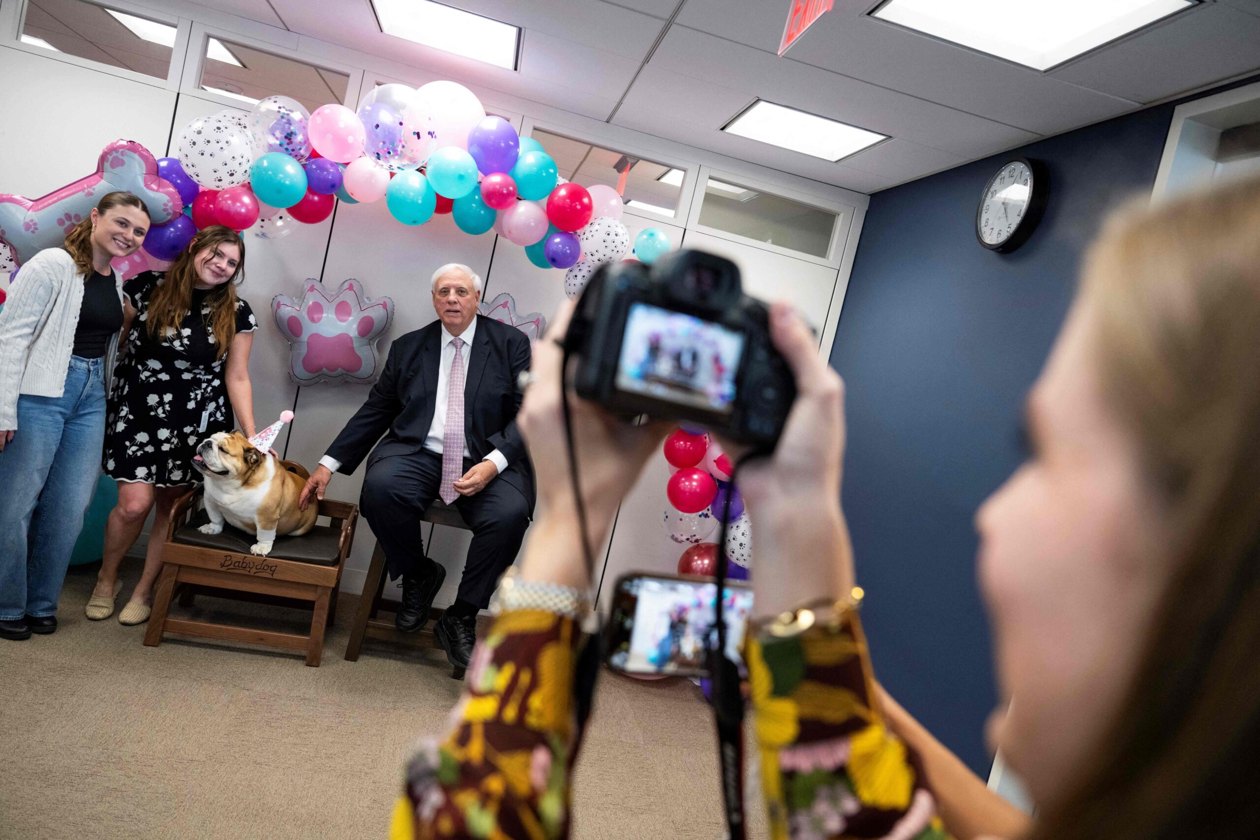 West Virginia Senator Jim Justice and his English bulldog Babydog greet well-wishers and have their photo taken at the senatorÂ’s office in Capitol Hill in Washington, DC, on October 15, 2025. (Photo by Roberto Schmidt / AFP)