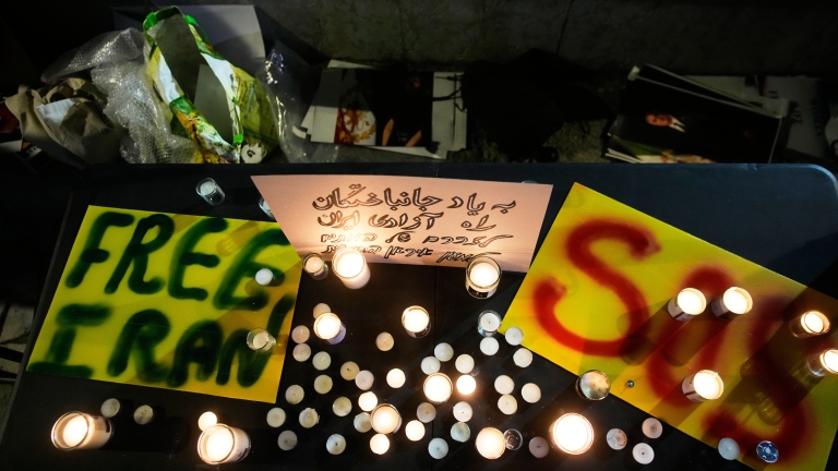 Demonstrators light candles during a rally in support of anti-government protests in Iran, in Holon, Israel Wednesday, Jan. 14, 2026. (AP Photo/Ohad Zwigenberg)