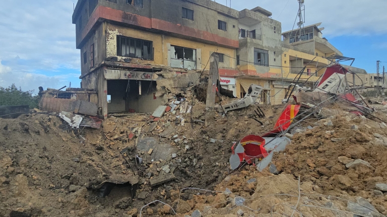 TOPSHOT - This picture shows the site of an overnight Israeli airstrike that hit Amana fuel station in the town of Deir Qanoun al-Nahr near Tyre in southern Lebanon on March 24, 2026. An Israeli strike on Bshamoun, south of Beirut, killed two peop...