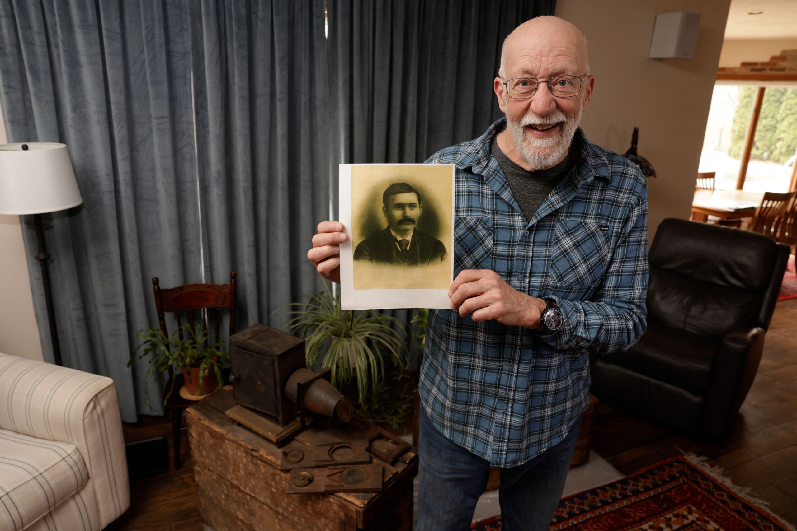 Bill McFarland holds up a photo of his great-grandfather William Delisle Frisbee at his home in Jenison, Michigan, on March 31, 2026. McFarland found a lost silent-era film, "Gugusse and the Automaton" made by film pioneer George Melies, in a box of films that had previously been owned by his great-grandfather, William Delisle Frisbee. He then donated those films to the Library of Congress who revealed the find on February 26. (Photo by JEFF KOWALSKY / AFP)