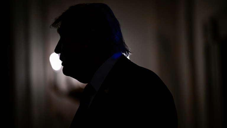 TOPSHOT - US President Donald Trump is pictured silhouetted as he participates in a Small Business Summit in the East Room of the White House in Washington, DC on May 4, 2026. (Photo by Kent NISHIMURA / AFP)