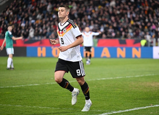 BRAUNSCHWEIG, GERMANY - MARCH 27: Nicolo Tresoldi of Germany celebrates scoring his team's second goal during the UEFA Under21 EURO Qualifier between Germany U21 and Northern Ireland U21 at Eintracht Stadion on March 27, 2026 in Braunschweig, Germany. (Photo by Stuart Franklin/Getty Images)