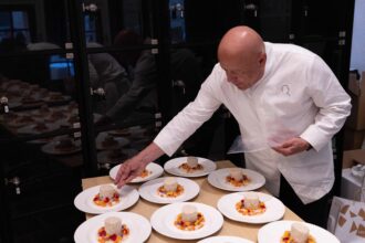 French chef Thierry Marx works on preparing dishes ahead of the Grand Dinner for Dogs at the Carnavalet Museum in Paris on September 28, 2026. (Photo by Xavier GALIANA / AFP)