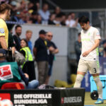 Sinsheim germany yukinari sugawara of sv werder bremen walks off the pitch after being shown a