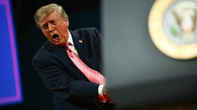 TOPSHOT - US President Donald Trump yells during a campaign rally at the Heartland Credit Union Arena in Park City, Kansas, a suburb of Wichita, on October 19, 2026. (Photo by Kent NISHIMURA / AFP)